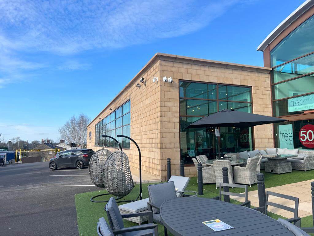 After image of commercial property outer wall sandblasted back to clean brickwork with moss and stains removed.