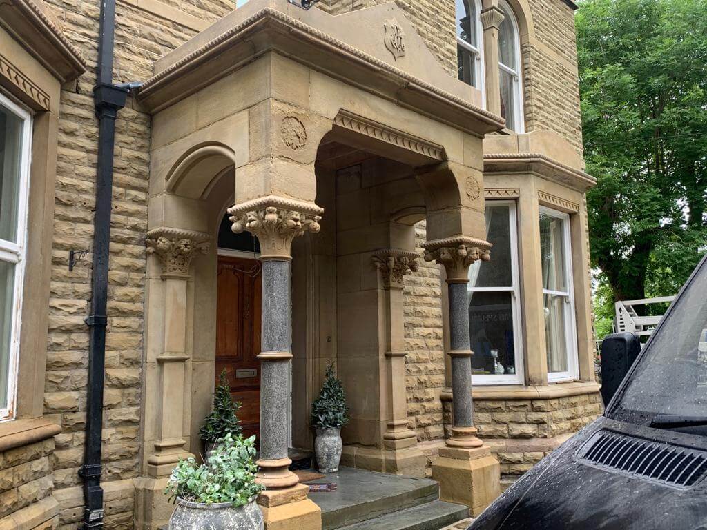 Clean limestone porch after sandblasting job completed.