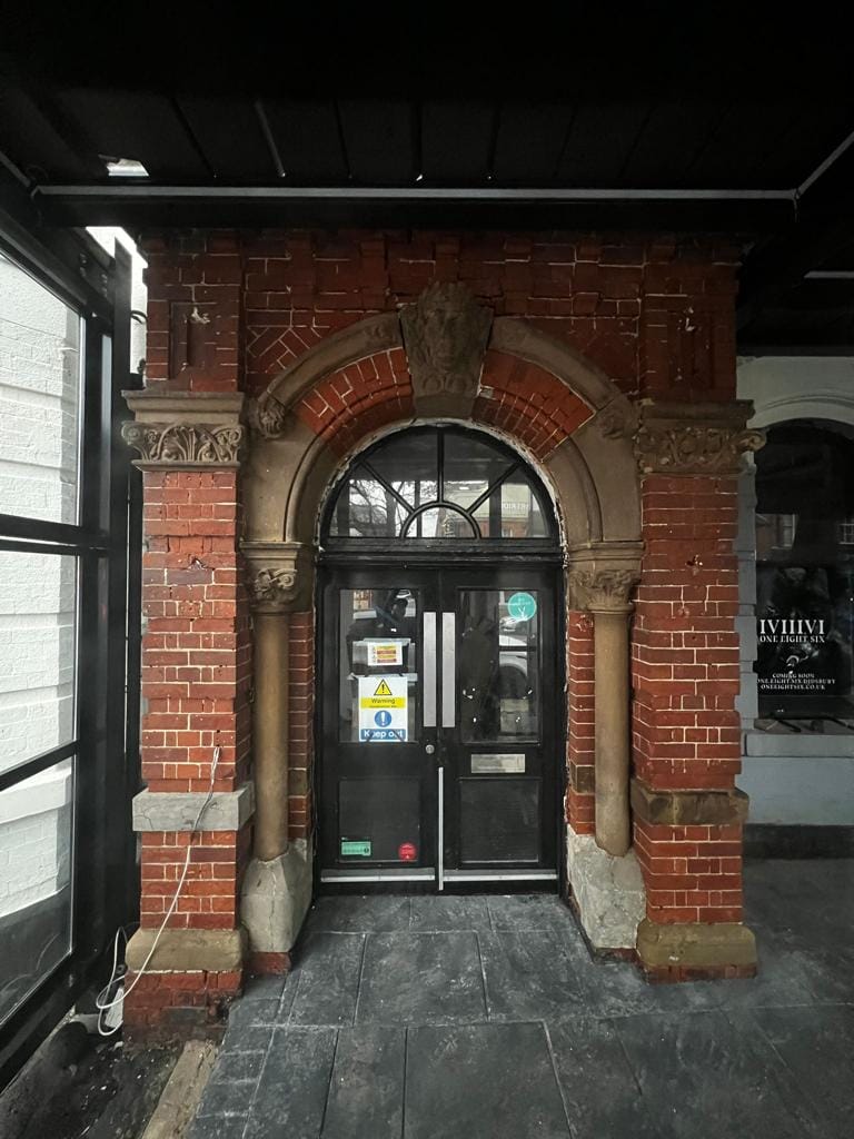 After image of large commercial building entrance stripped back to bare brickwork after soda blasting job completed.