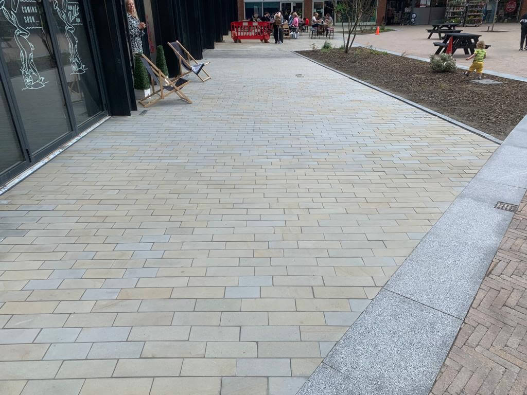 Commercial shared footpath bright and clean after blasting and jet washing.