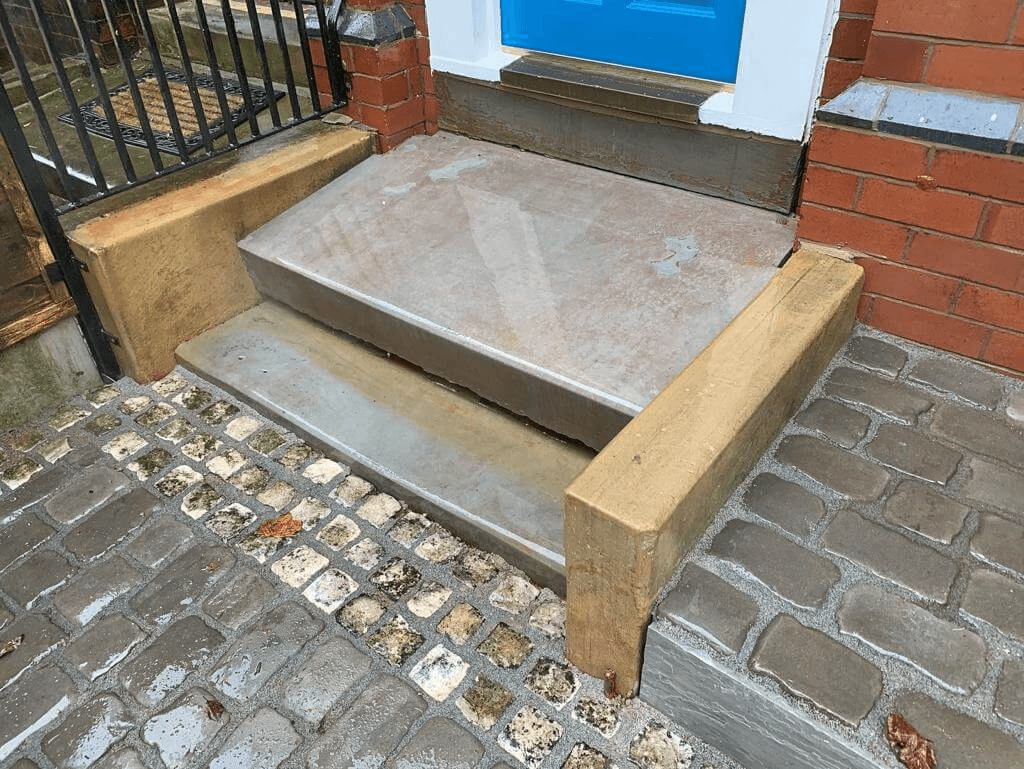 After image of doorstep with sandblasted and jet washed clean.