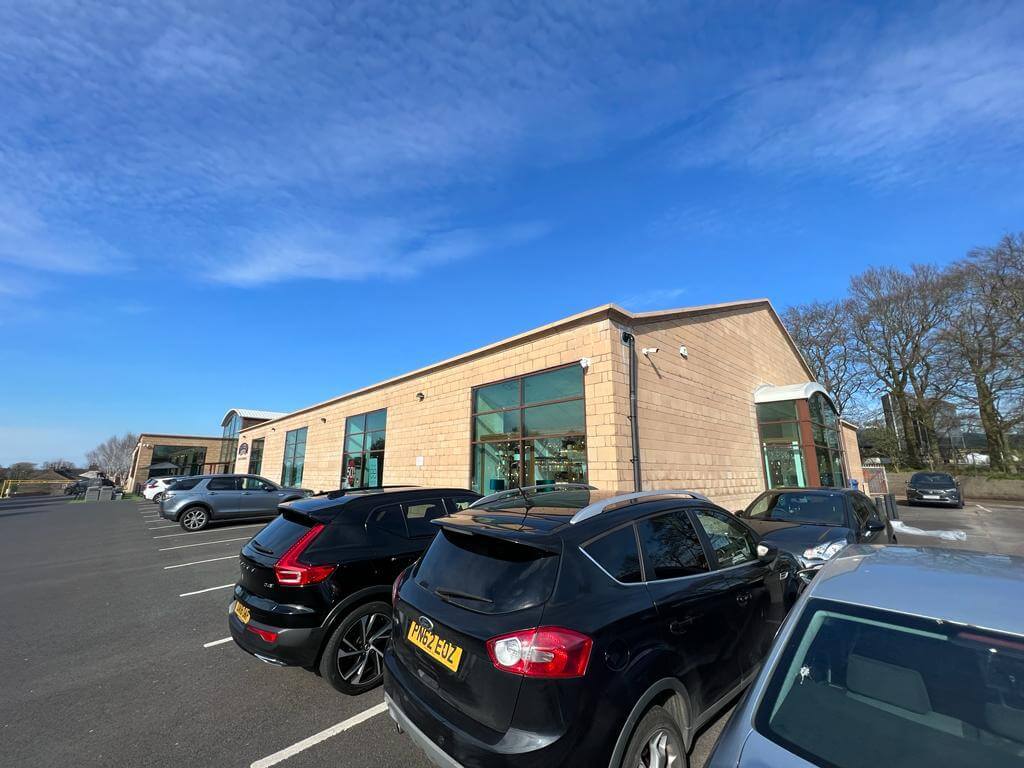 Wide angle after image of commercial property showing completely cleaned after abrasive blasting across the whole building completed.