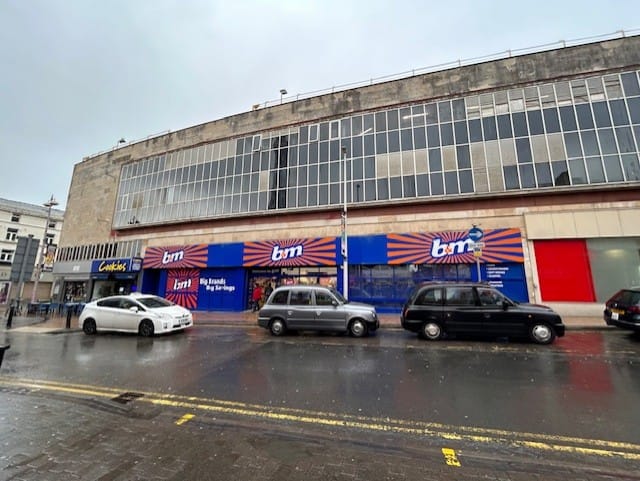 Side angled before view of MBH shops in Blackpool town centre.