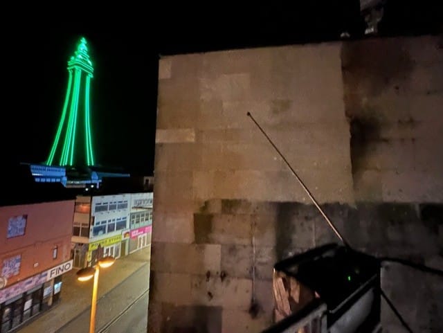 View of Blackpool Tower at night from the rooftop of MBH Blackpool during blasting work.