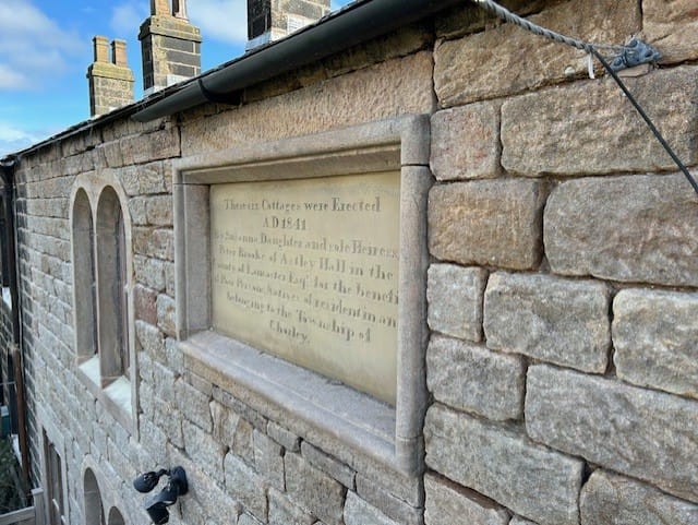 Close up after image of Whittle cottages sign.