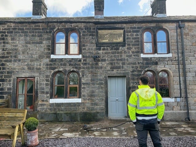 JJL Team member stood surveying site at Whittle cottages in Chorley.